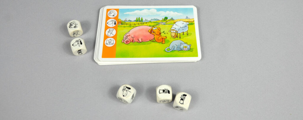 Kuh und Co. das Würfelspiel für Kinder ab 4 Karten und Würfel sind zu sehen